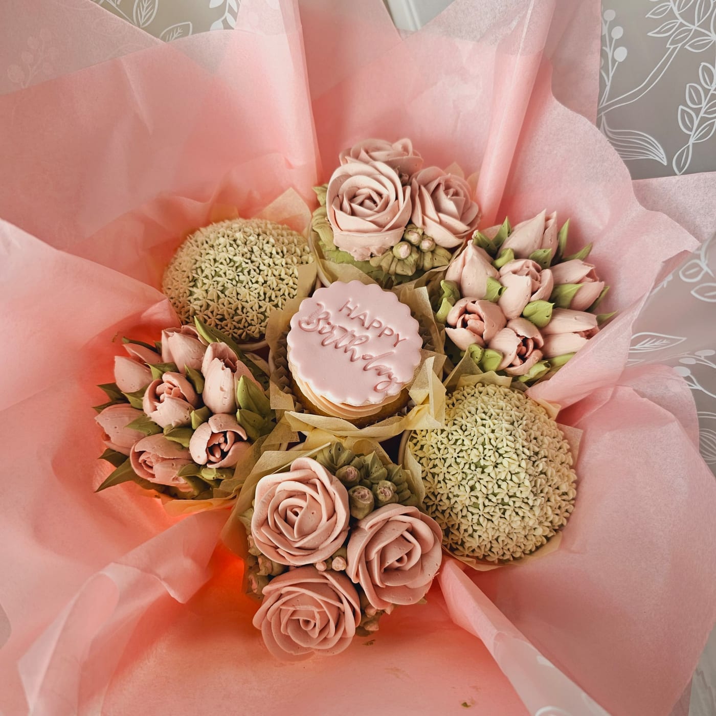 Seven-cupcake Happy Birthday flower bouquet by Amour Desserts